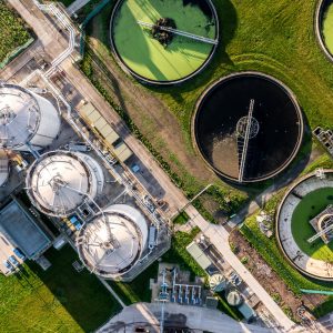 Aerial view above wastewater treatment plant with water storage tank Aerial view above wastewater treatment plant with water storage tank